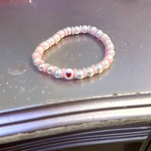 Light pink clay bracelet with red heart